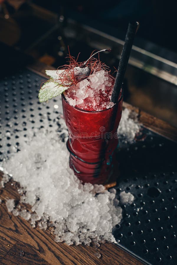 Strawberry Cocktail with Crushed Ice on a Red Gradient Stock Photo
