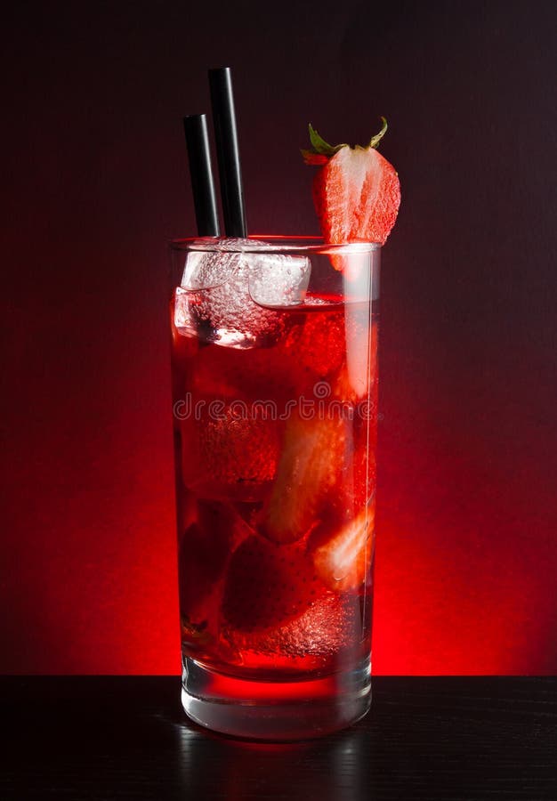 Strawberry cocktail with ice on black table