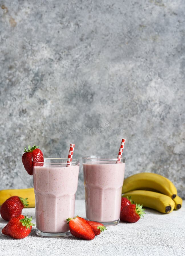 Strawberry cocktail - a milkshake with ice cream and milk. Strawberry smoothie for breakfast