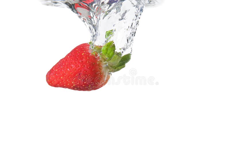 Strawberry dunk in the water