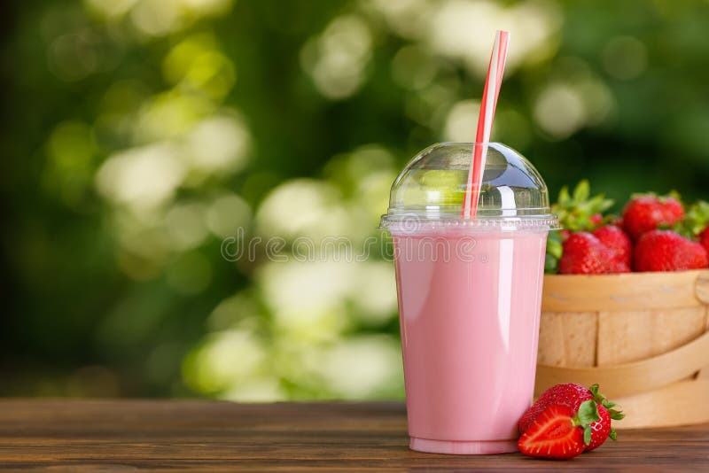 https://thumbs.dreamstime.com/b/strawberry-milkshake-disposable-plastic-glass-wooden-table-strawberry-milkshake-disposable-plastic-glass-straw-222498507.jpg