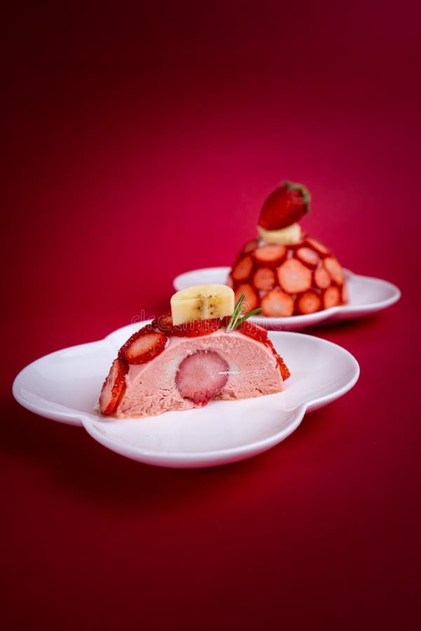 Strawberry Mousse Domes cake on red Background stock photos Strawberry Mousse Domes cake on red Background stock photos