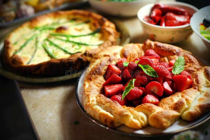 Strawberry puffed pastry pie with mint leaves