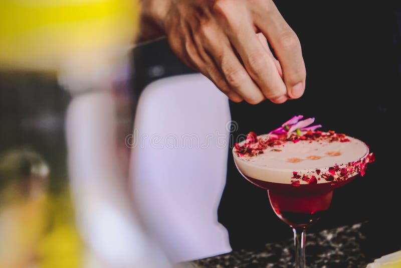 Strawberry rose cocktail with purple flower. Delicious strawberry rose cocktail with purple flower on top. Decorated with roses royalty free stock photo Strawberry rose cocktail with purple flower. Delicious strawberry rose cocktail with purple flower on top. Decorated with roses royalty free stock photo