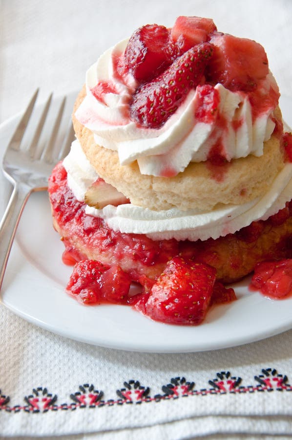 Strawberry shortcake on a napkin with red trim