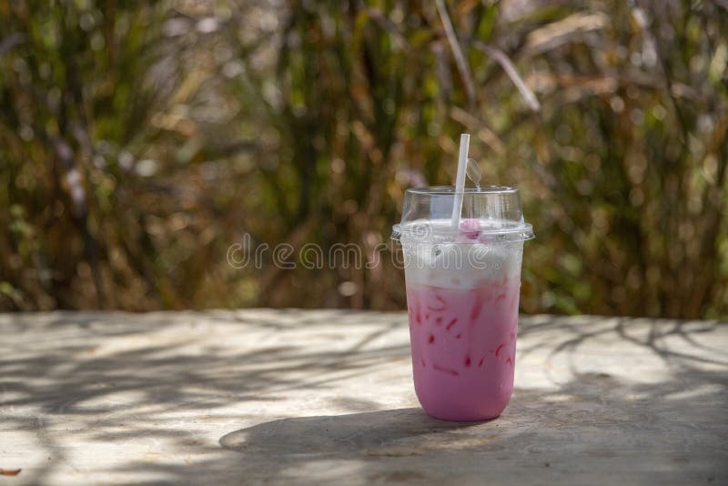 Plastic cup of milkshake with strawberries isolated on white Stock Photo by  ©belchonock 76818941