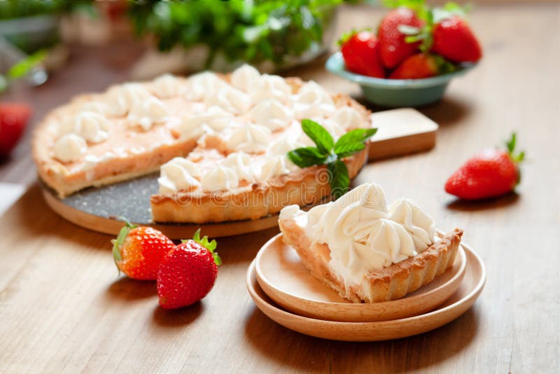 Strawberry tart cake decorated with whipped cream and fresh berries. Summer dessert pie