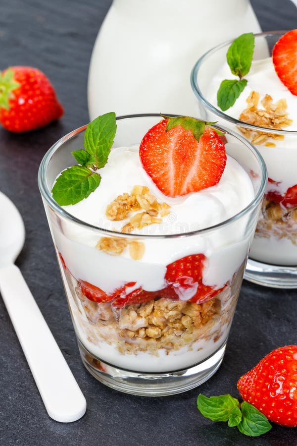 Strawberry yogurt yoghurt strawberries fruits cup muesli portrait format slate spoon breakfast. Food stock photos Strawberry yogurt yoghurt strawberries fruits cup muesli portrait format slate spoon breakfast. Food stock photos