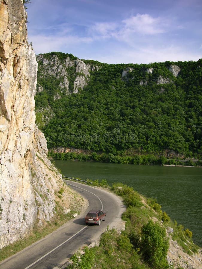 The road of Danube gorge is following the river, for 100 km. In the other side of the river si Serbia country. The road of Danube gorge is following the river, for 100 km. In the other side of the river si Serbia country.