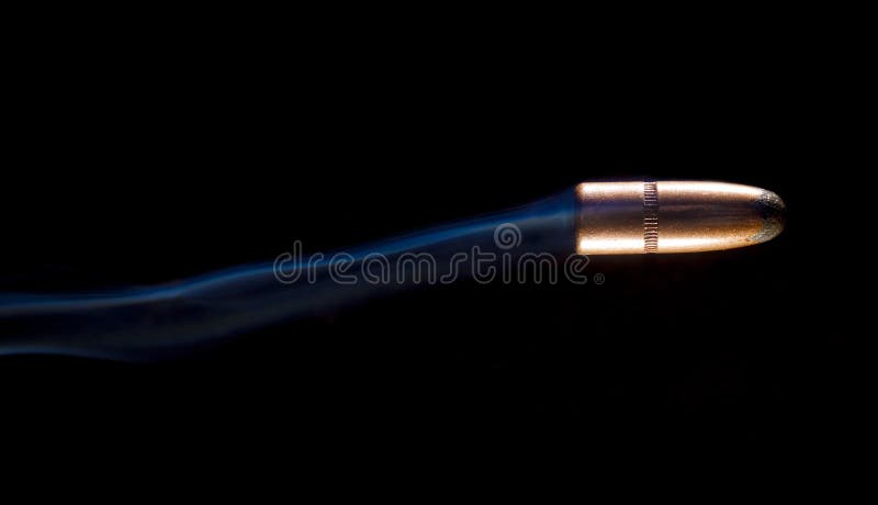 Streaking bullet with smoke royalty free stock photography