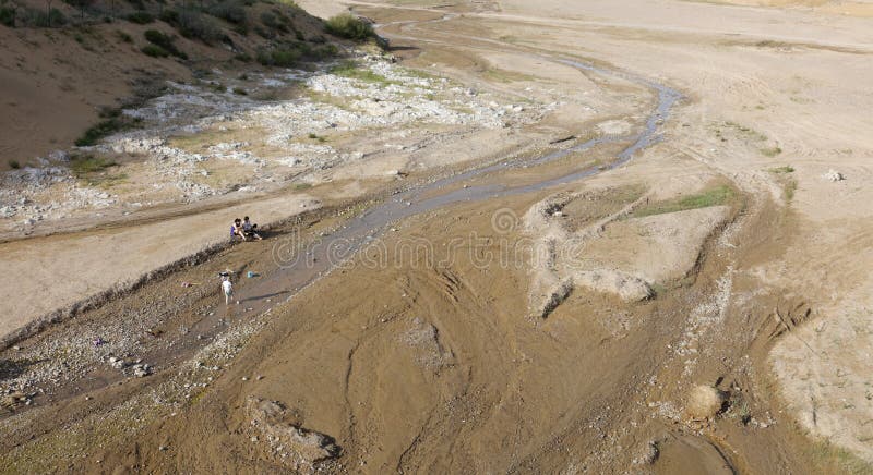 Xiangshawan is chinese first desert resort. tourists play by the stream. in the desert, water is especially precious. Xiangshawan is chinese first desert resort. tourists play by the stream. in the desert, water is especially precious.