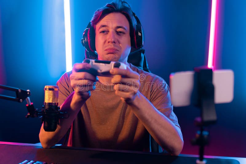 Streamer with control joystick live streaming by smartphone rec. Pecuniary. stock photography