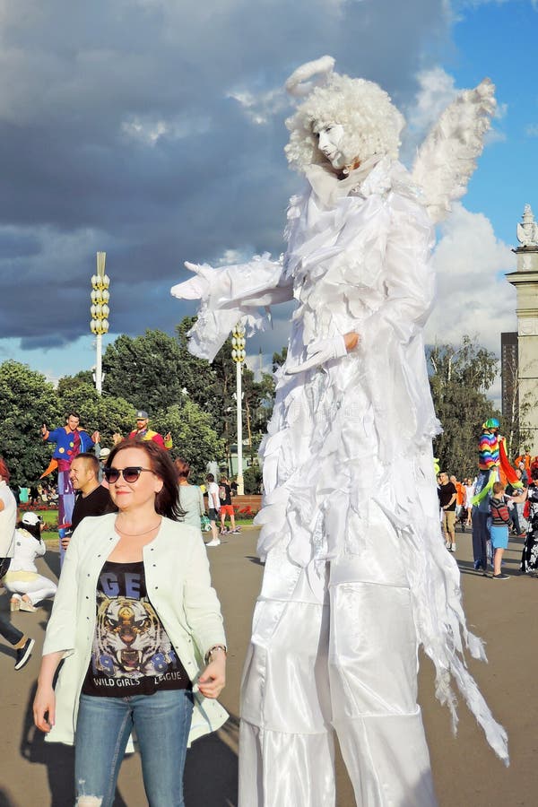 Street actor dressed like an angel poses for photos in Moscow royalty free stock photography Street actor dressed like an angel poses for photos in Moscow royalty free stock photography