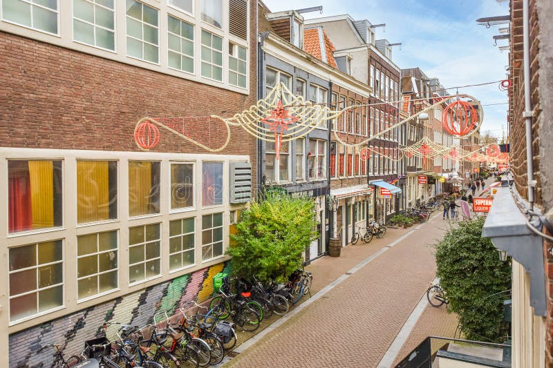 A Street in Amsterdam with Bikes Parked in Front Editorial Image ...