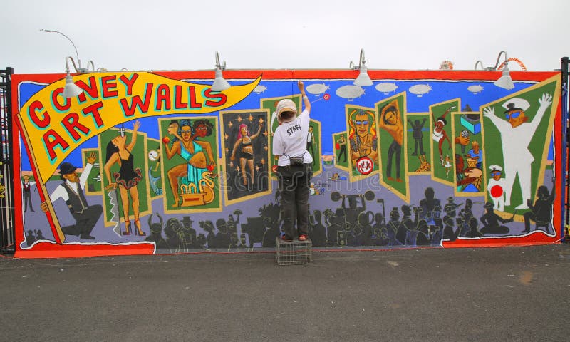 Street artist painting mural at new street art attraction Coney Art Walls stock photography Street artist painting mural at new street art attraction Coney Art Walls stock photography