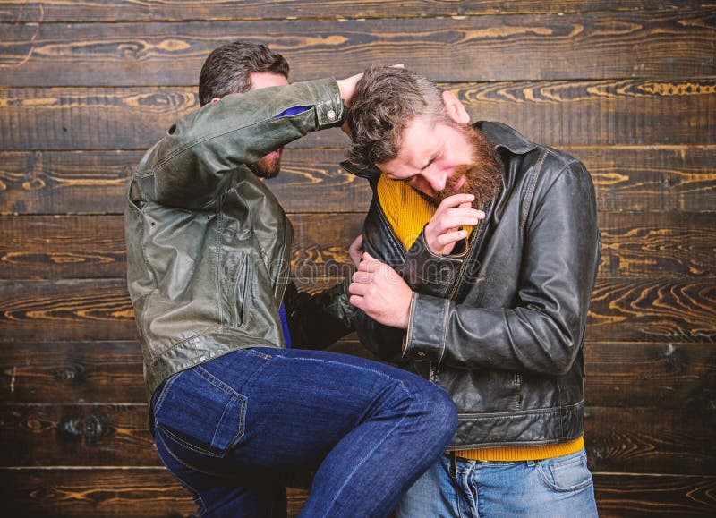 Street fight concept. Men brutal hooligans wear leather jackets fighting. Physical attack. Men bearded hipster fighting stock photos Street fight concept. Men brutal hooligans wear leather jackets fighting. Physical attack. Men bearded hipster fighting stock photos