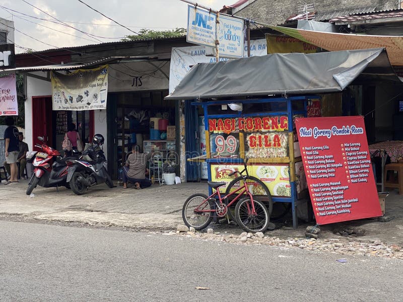 A Street Food Cart Selling Variations of Fried Rice Editorial Photo
