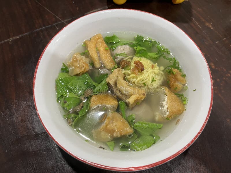 A bowl of Bakso which is Indonesian famous street food consist of meat ball, noodle and beef broth.