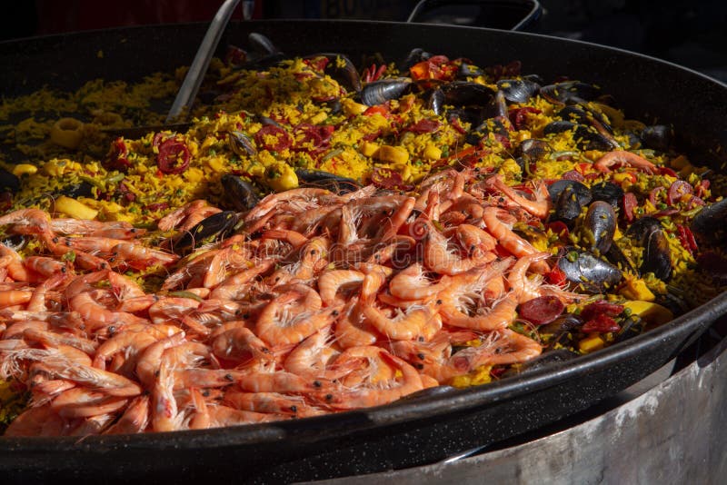 Street Food in France, Fresh Prepared Paella with Rice and Sea F Stock