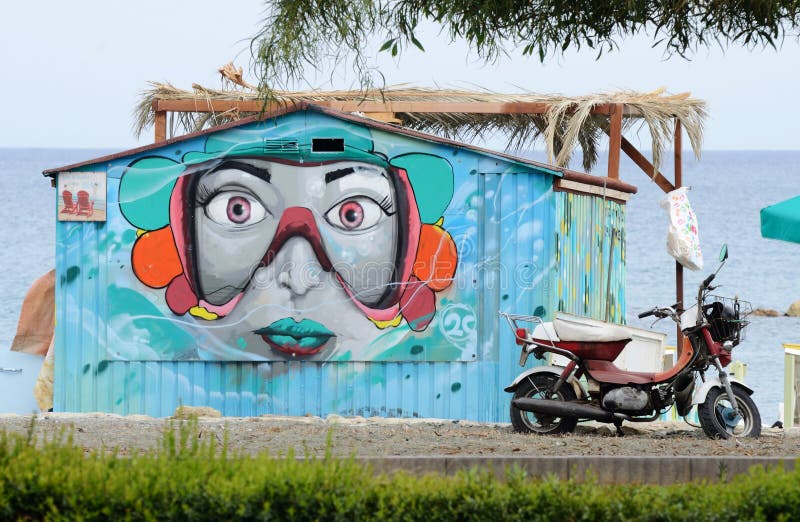 Street graffiti art depicting woman face at public beach of Limassol,Cyprus