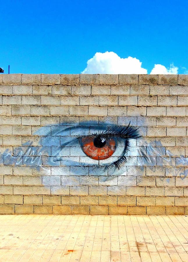 Street graphics depicting the human eye, street art stock photo
