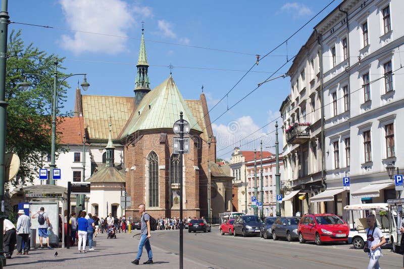Street in Krakow in Poland. Street in Krakow with view of Church of St. Francis of Assisi and All Saints Square stock photos Street in Krakow in Poland. Street in Krakow with view of Church of St. Francis of Assisi and All Saints Square stock photos