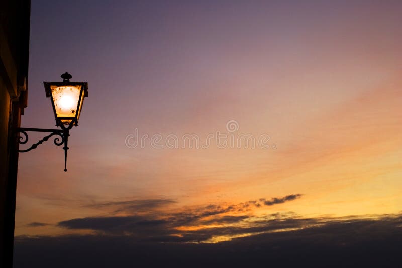 Street lamp and sunse