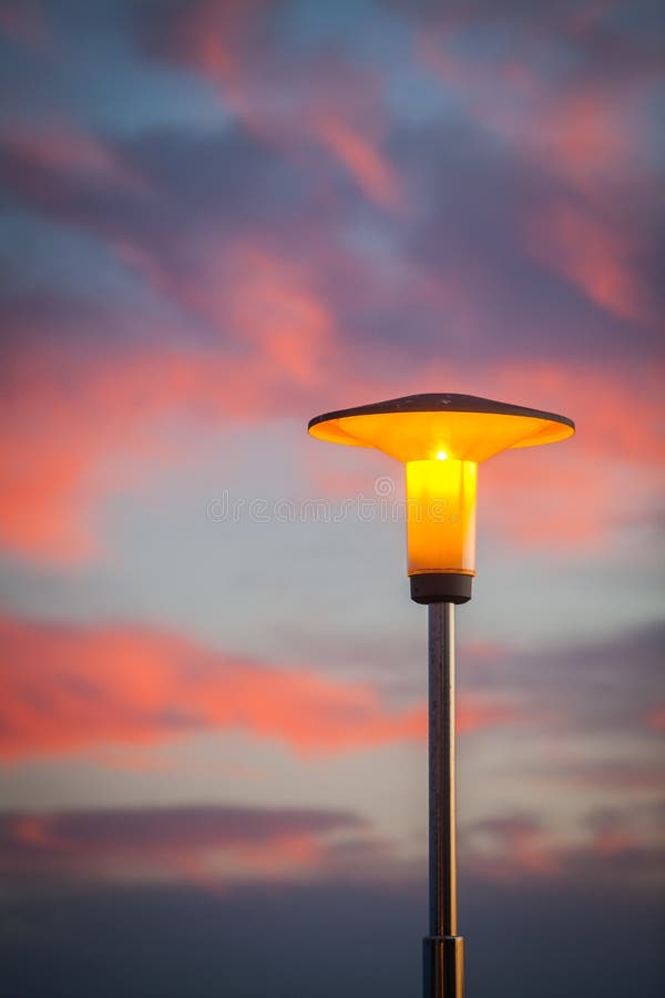 Street lamp at sunset stock photo. Image of sunset, twilight - 79881754