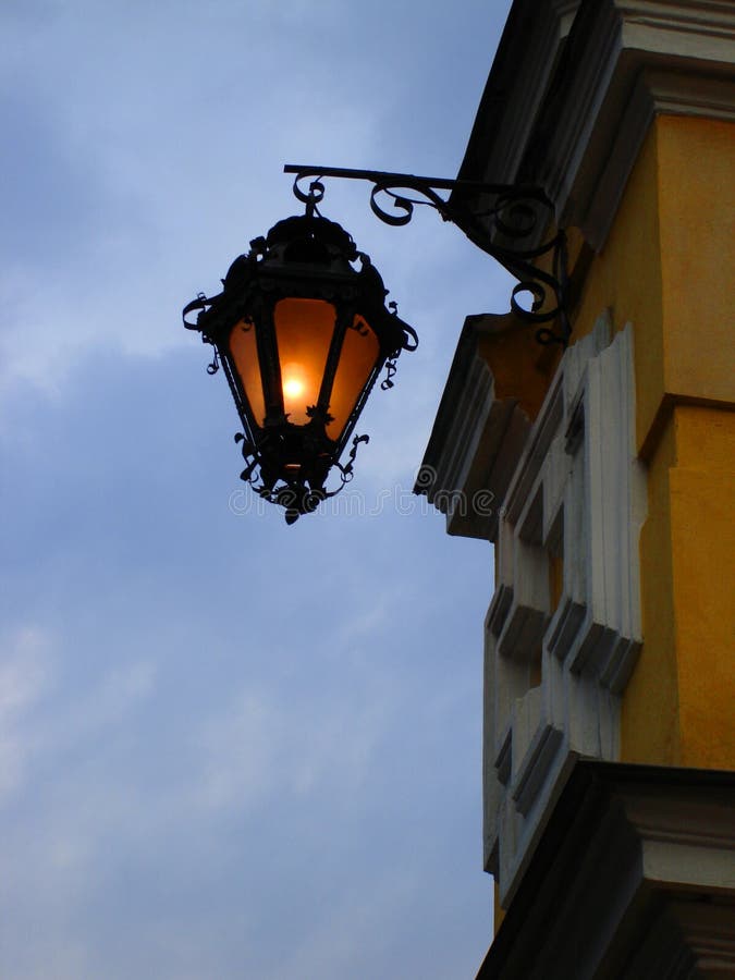 Street lamp on a yellow wall