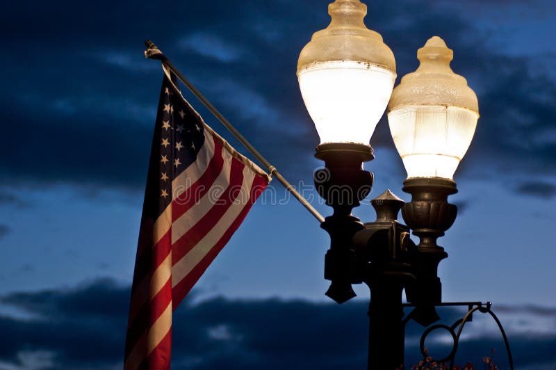 Street lamps and a flag stock image. Image of urban, antique 28928853