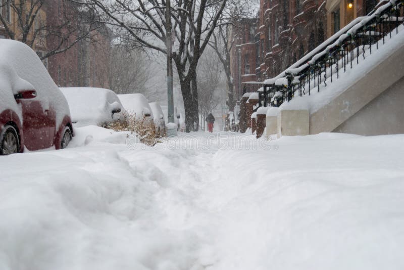 Street level shot during a blizzard with heavy snowfall in Harlem, New York City stock photos Street level shot during a blizzard with heavy snowfall in Harlem, New York City stock photos
