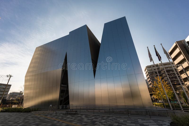 Tokyo, Sumida-ku - Nobember 17, 2017 : Street without people. Sunset view of Sumida Hokusai Museum (Sumida Hokusai Bijutsukan). Designed by Kazuyo Sejima