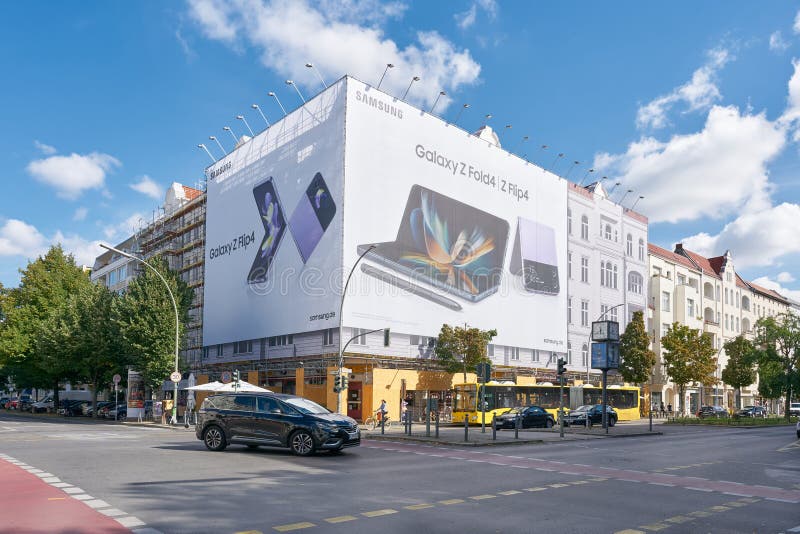 Street scene on Kantstrasse in Berlin with advertising for a smartphone