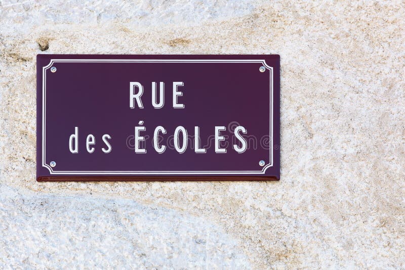 Street of schools sign on a wall in french stock images Street of schools sign on a wall in french stock images