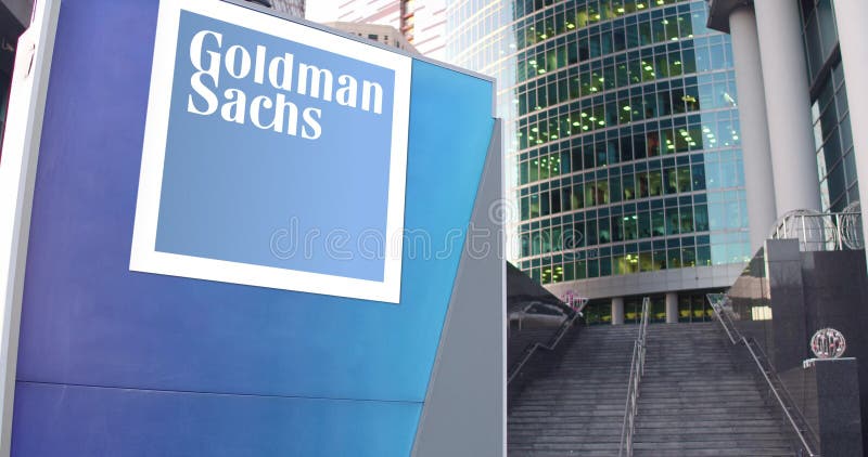 Street signage board with The Goldman Sachs Group, Inc. logo. Modern office center skyscraper and stairs background. Editorial 3D