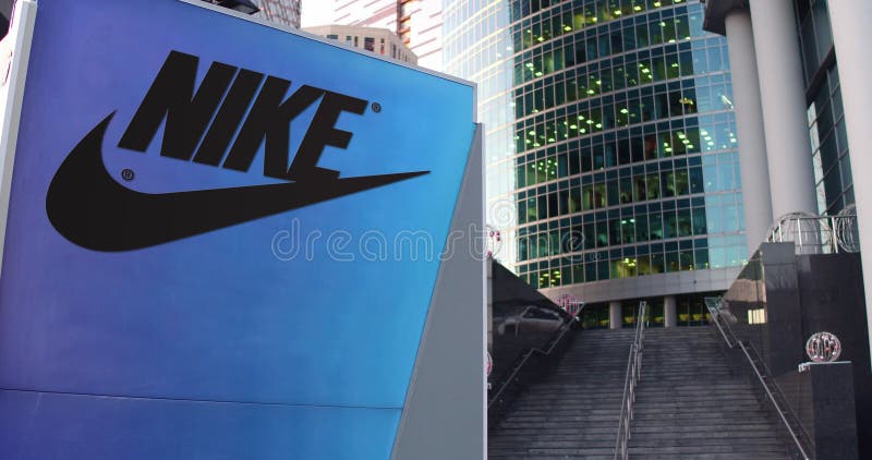 Signage Board with Nike and Logo. Modern Office Skyscraper, Stairs Background. Editorial 3D Editorial Stock Image - Illustration of brand, footwear: 81696319