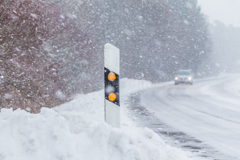 The street track is slick and frozen. High dangerous risk of an accident through the blizzard snowstorm and severe weather at christmas time season. The street track is slick and frozen. High dangerous risk of an accident through the blizzard snowstorm and severe weather at christmas time season.