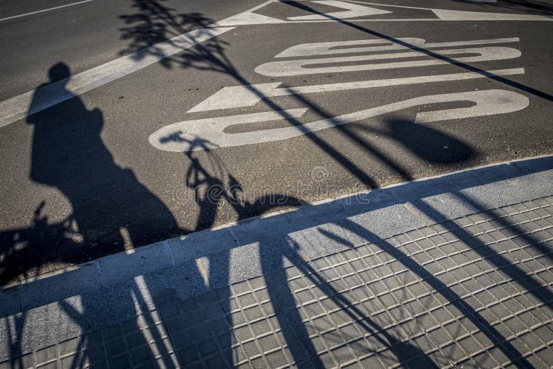 Street with traffic sign and bicycle shadow in Sant Cugat del Va