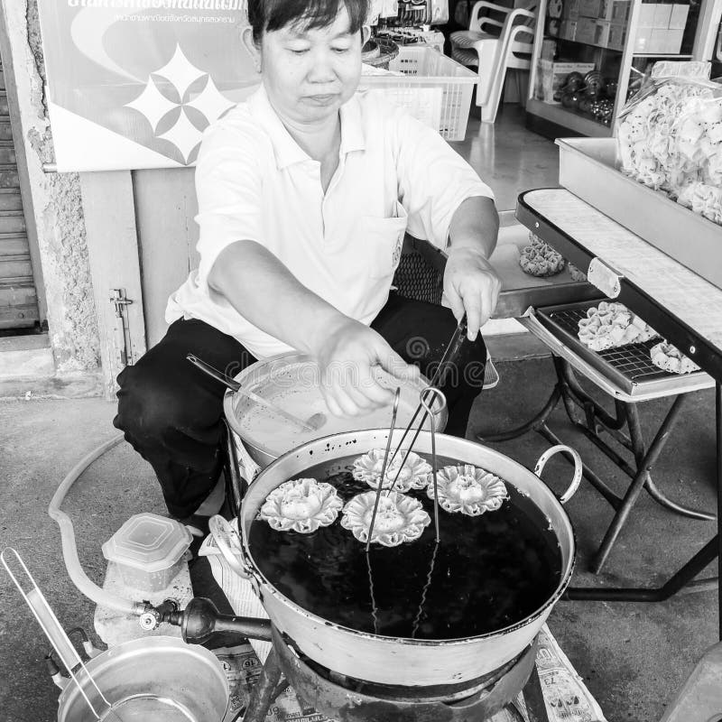 Street Vendor Prepares Traditional Thai Food in Bangkok, Thailand.Stree