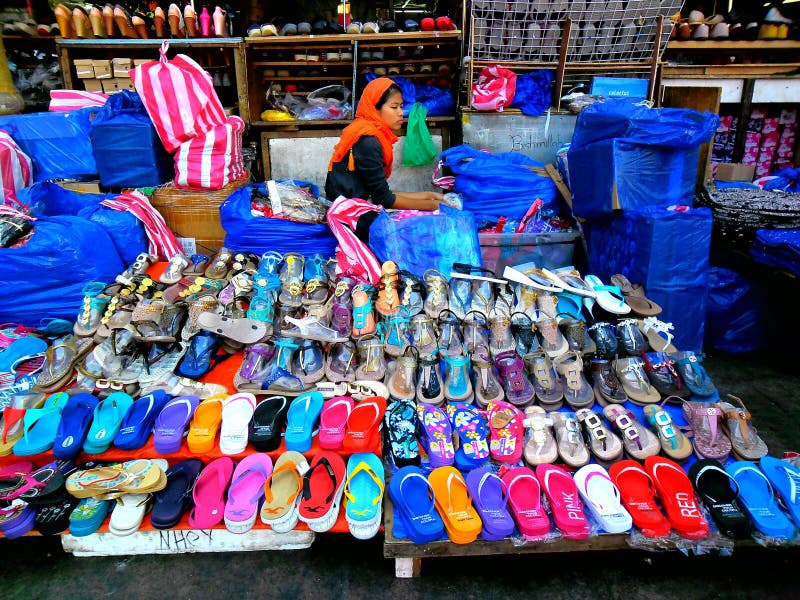 Street Vendor Selling Slippers Editorial Photography - Image of ...