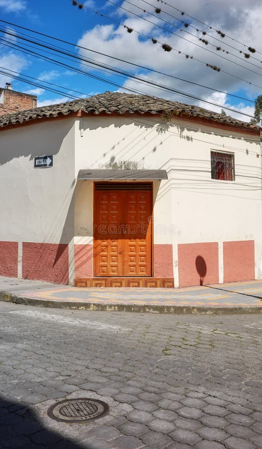 Street view of an old building facade in Otavalo, Ecuador stock photography