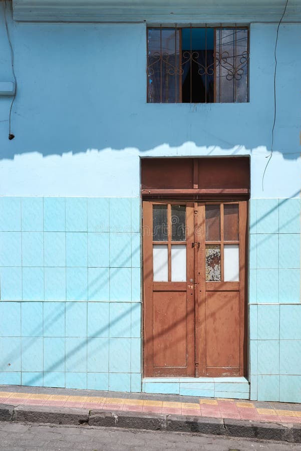 Street view of an old building facade in Otavalo, Ecuador stock image