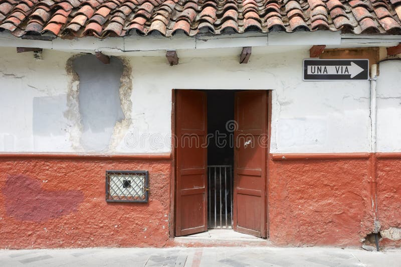 Street view of an old colonial building facade, Cuenca, Ecuador stock photos