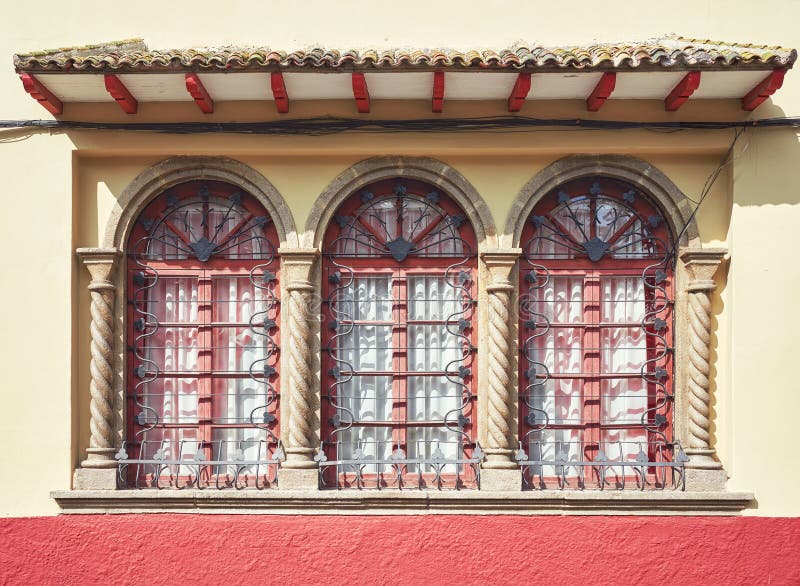 Street view of an old colonial building facade details, architecture background, Cuenca, Ecuador stock photo