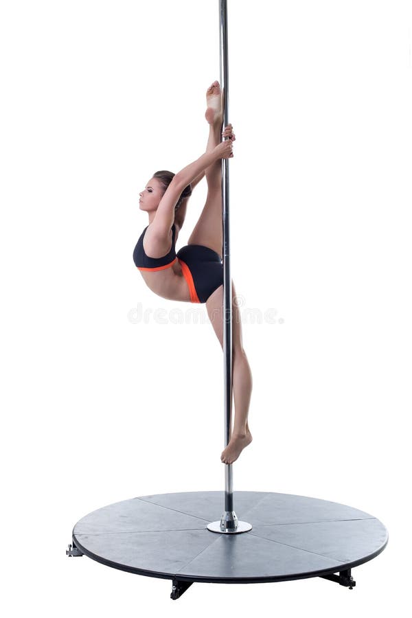 Strength and grace of pole dance. Cute girl posing stock photography