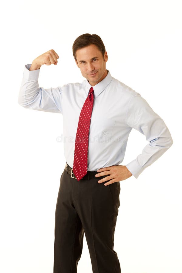 Portrait of a corporate business executive flexing his arm muscle. Portrait of a corporate business executive flexing his arm muscle