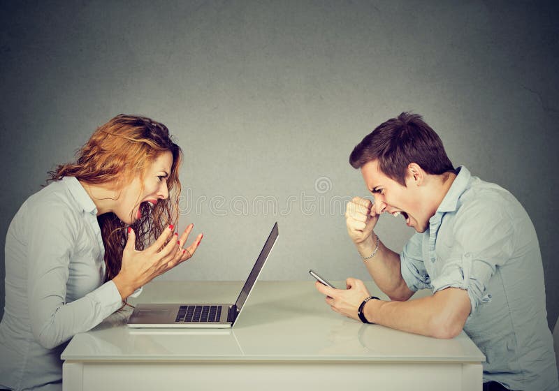 Stressed business women with laptop sitting at table with angry men screaming at mobile phone. Stressed business women with laptop sitting at table with angry men screaming at mobile phone.