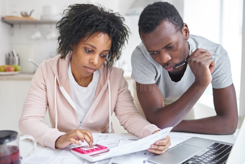 jpg sitting at kitchen table worried about expenses jpg