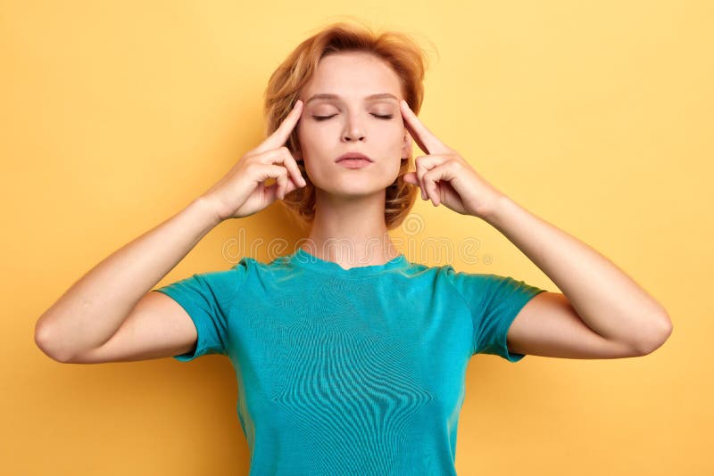 Stressed beautiful woman with closed eyes concentrated on her thoughts stock photos Stressed beautiful woman with closed eyes concentrated on her thoughts stock photos