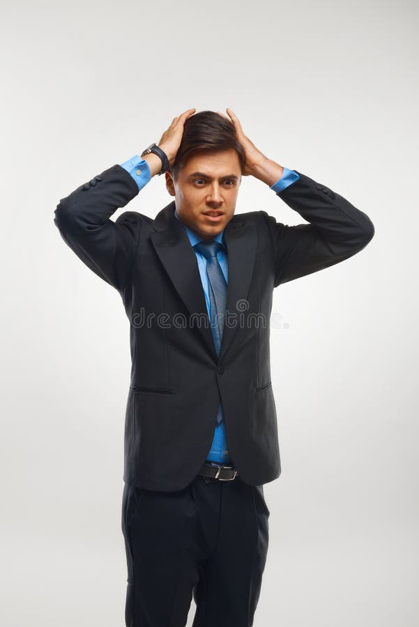 Stressed Businessman against white background stock photos
